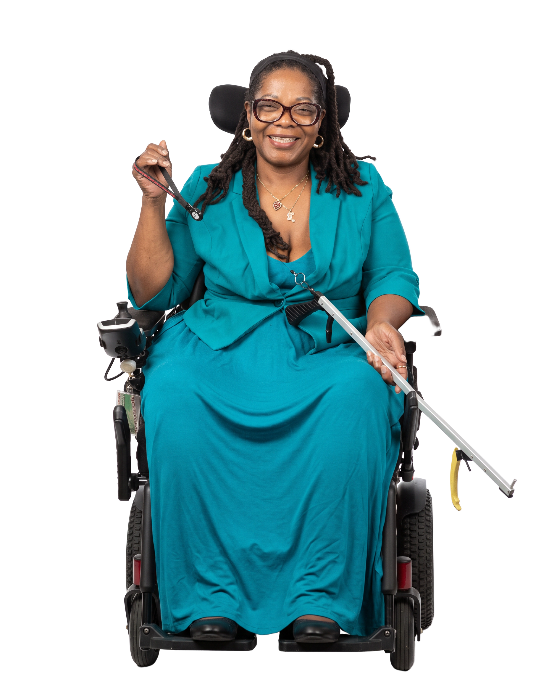 Phoenix Harlee, founder of WheelchairAbility LLC and inventor of the patented Reacher Keeper, seated in her power wheelchair holding a reacher